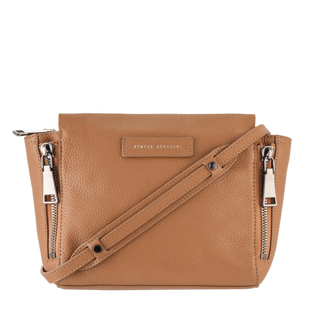 paddington-store-status-anxiety-bag-ascendants-tan-front-with-strap-wrapped